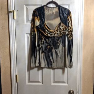 Cute leopard size medium blouse with leather shoulders. Excellent condition!